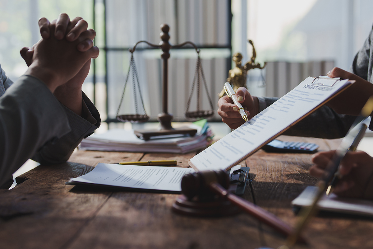 person looking at contract in legal office