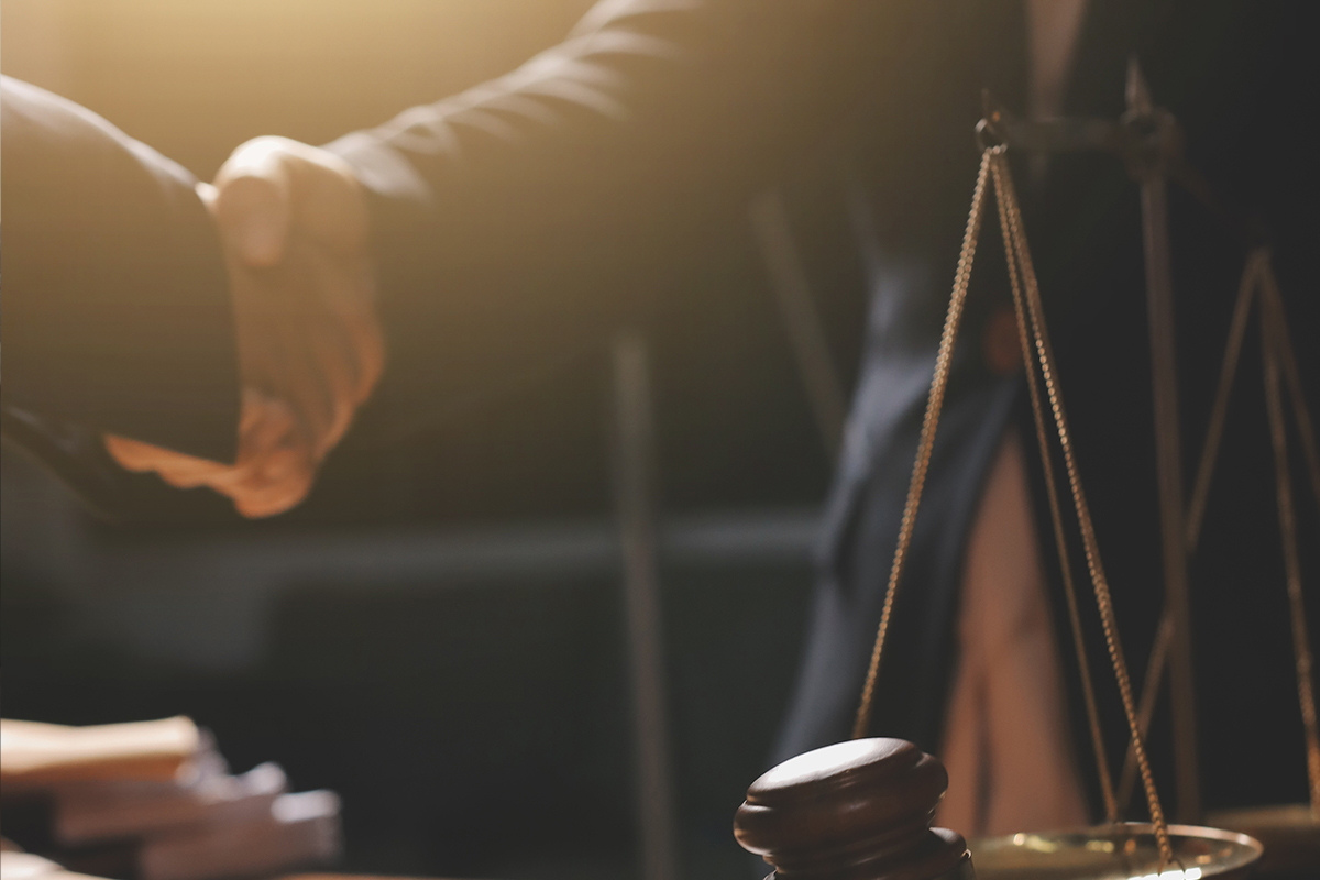 shaking hands in legal office